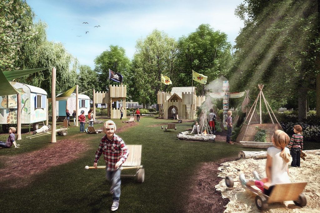 Spielwiese auf der Kinder spielen, rechts ein Sandkasten, im Hintergrund Kletter und Spieleinrichtungen